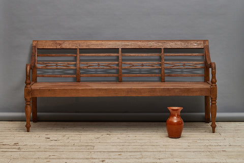 Elegant Dutch Colonial Teak Bench with Turned Legs and a Carved Back from Jakarta