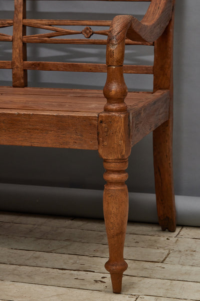Elegant Dutch Colonial Teak Bench with Turned Legs and a Carved Back from Jakarta